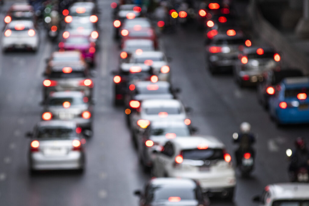 Urban real estate demand and accessibility challenges reflected through heavy city traffic congestion.