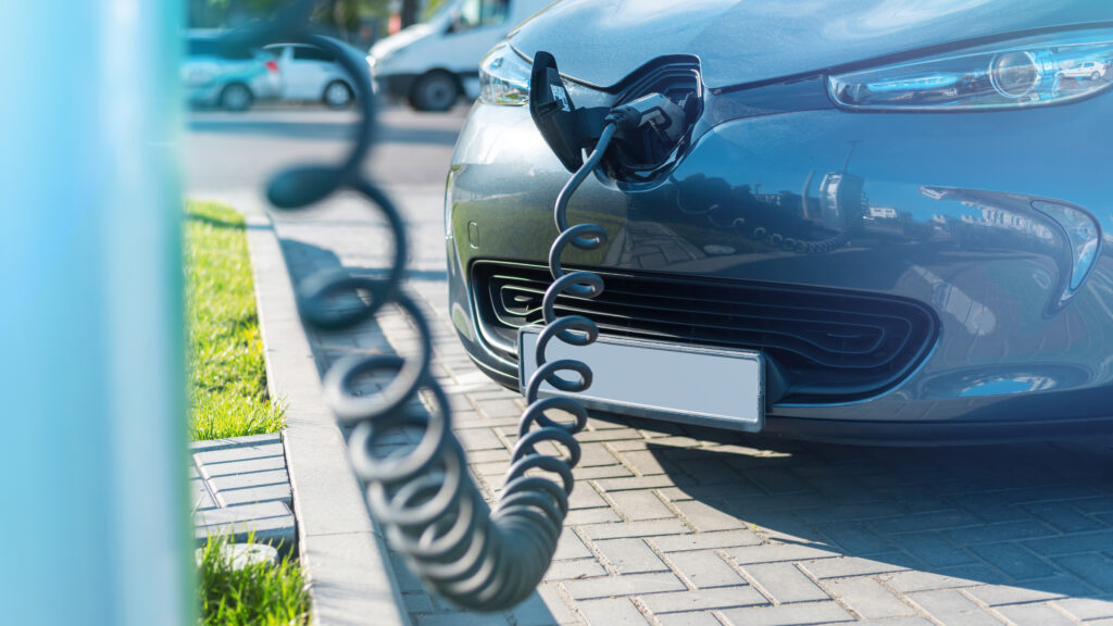 Residential parking infrastructure with integrated EV charging facility in planned housing project