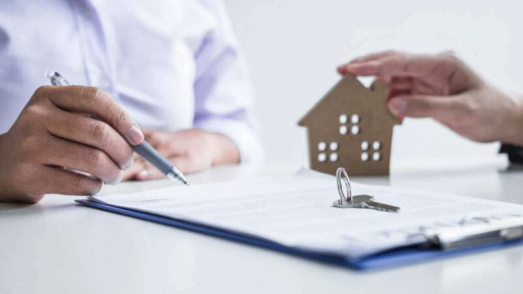 Property transaction contract signing representing ownership transfer documentation process
